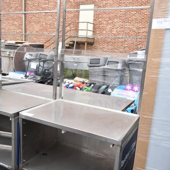 Commercial stainless steel cart with under shelf and commercial casters. Well-maintained, ideal for heavy-duty use.