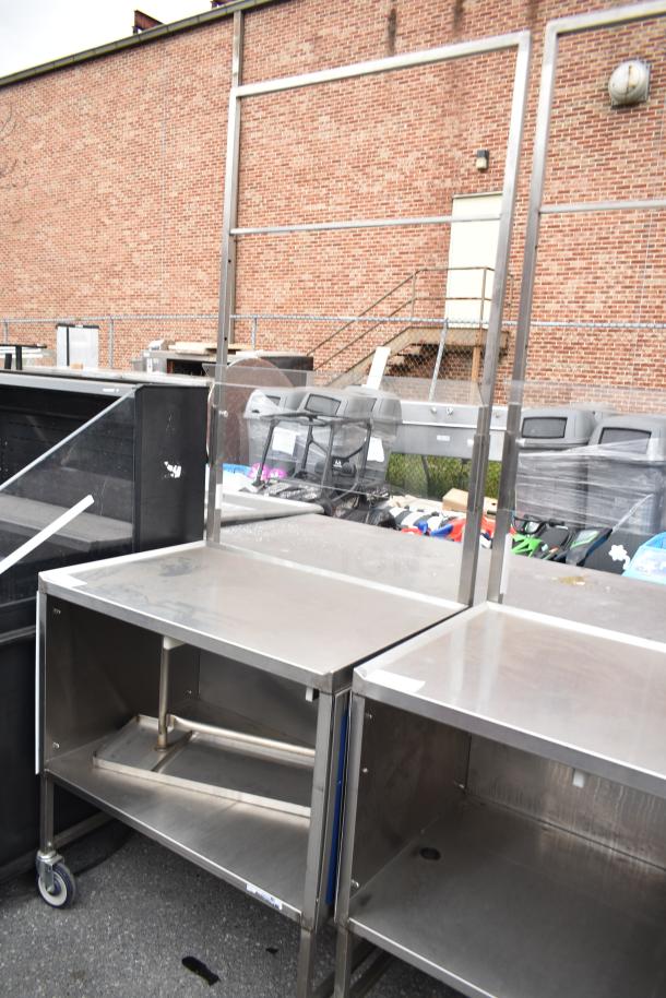 Commercial stainless steel cart with under shelf on heavy-duty casters, excellent condition, ideal for kitchen use.