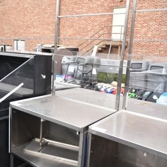 Commercial stainless steel cart with under shelf on heavy-duty casters, excellent condition, ideal for kitchen use.