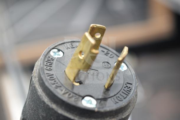 Close-up of Killion Grab N Go Merchandiser plug, 120/208-240V, showing three-prong Leviton connector.