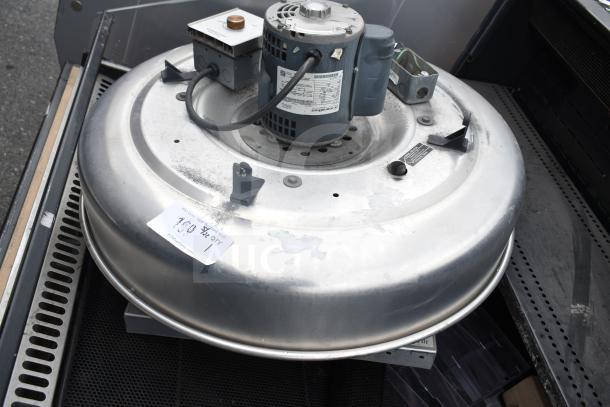 Greenheck 6-133-A-X commercial rooftop mushroom exhaust fan, metal finish, visible motor and wiring, moderate wear, label attached.