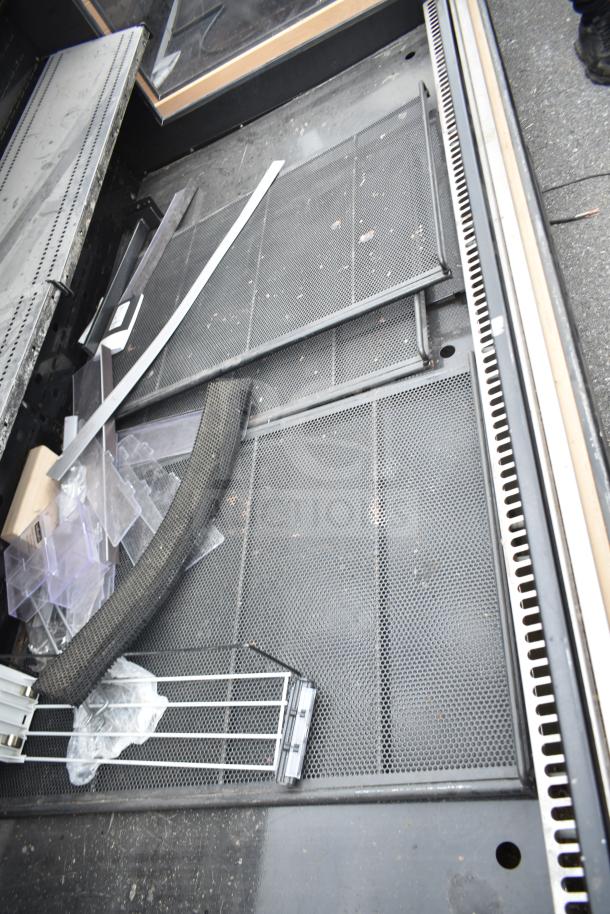 Killion Commercial Open Grab N Go Merchandiser in black. Visible shelving components, used condition. 120/208-240V.