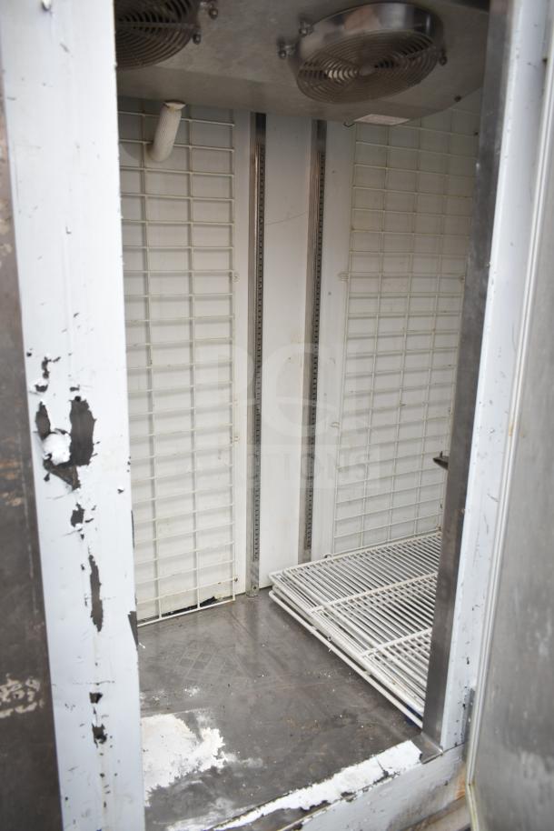 Leader FR79 S/C commercial 3-door reach-in cooler. Interior view shows cooling fans and shelves. Some visible wear.