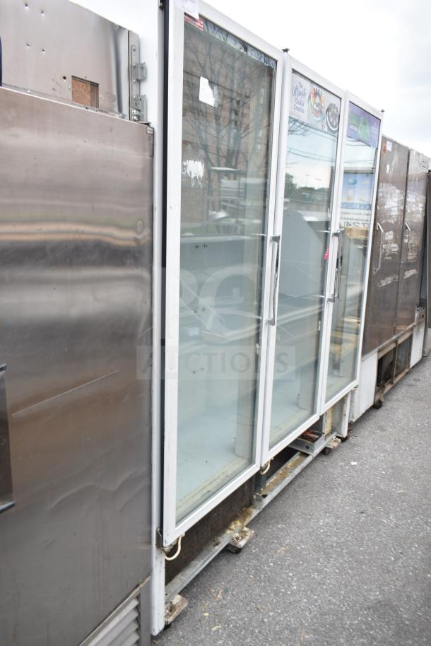 National ULG80BCP-6 commercial 3-door reach-in freezer merchandiser, glass doors, used condition, visible exterior wear.