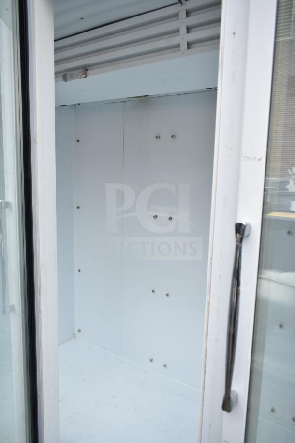 National ULG80BCP-6 commercial freezer interior, three-door, white finish, 115/208-230 volts, one phase, clean condition.
