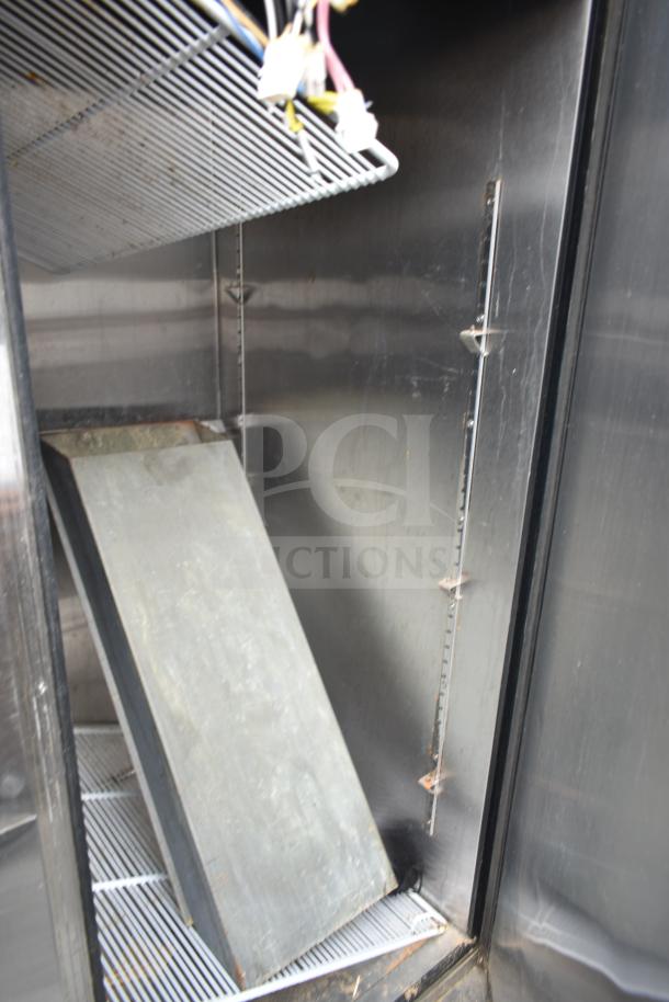 2016 Atosa MBF8508 commercial 3 door cooler interior; metal shelves, showing wear. 115V, 1 phase.