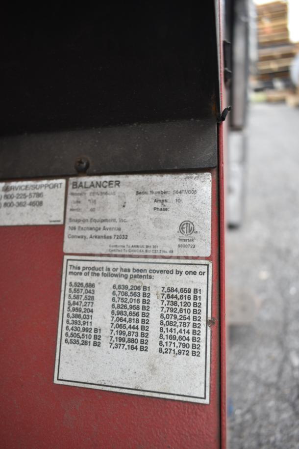 JohnBean Commercial Balancer with visible serial number 564FVM008, showing patent details and brand labeling.