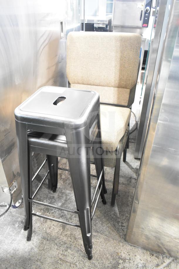 Four furniture items including two metal bar stools and two upholstered chairs. Bar stools have a black finish.