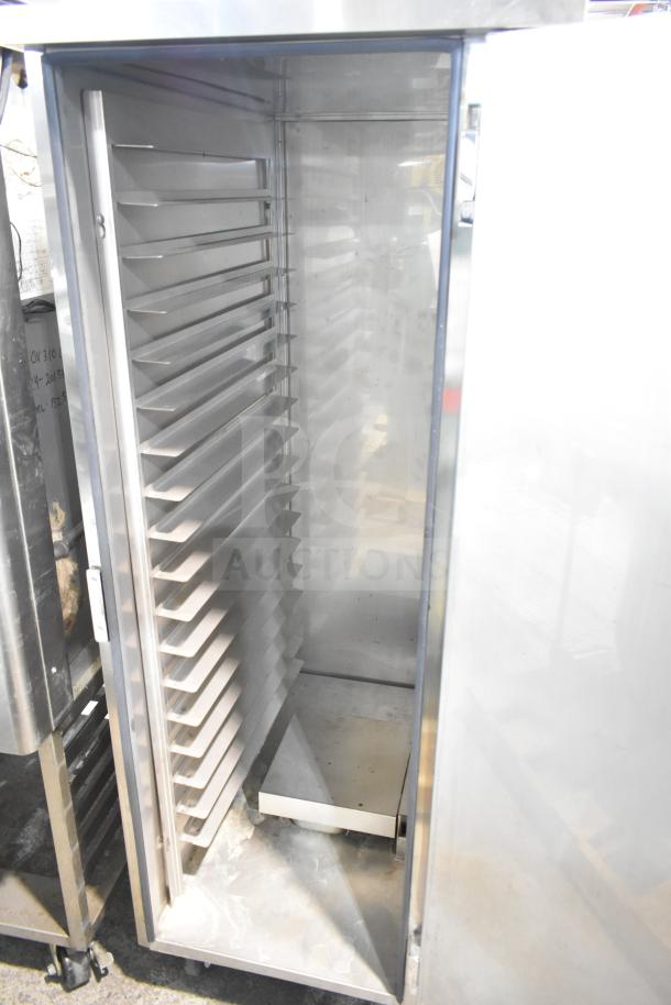 FWE TS-1633-36P heated holding cabinet on casters, commercial grade, 120V, 1 phase. Interior racks visible, good condition.