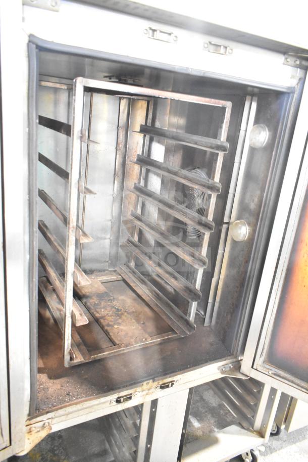 Baxter commercial natural gas mini rotating rack oven with double pan rack and commercial casters, used condition.