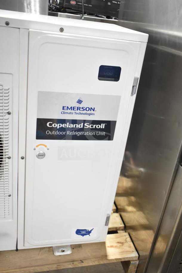Copeland XFAM-010Z-TFC-081 condensing unit, 208-230V, 3 phase, white, Emerson Climate Technologies label, outdoor refrigeration use.