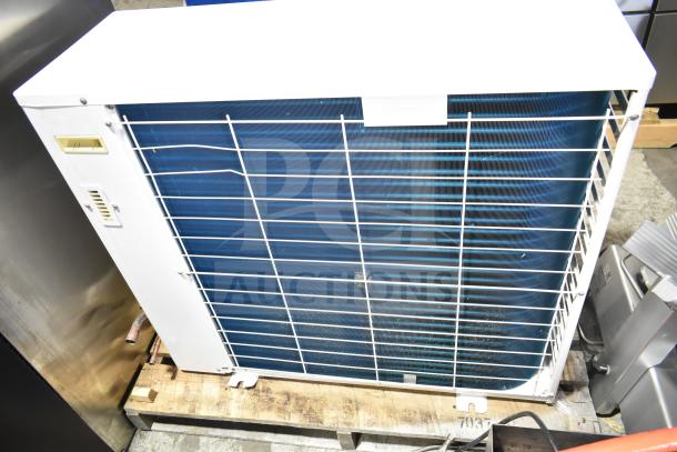 Copeland XFAM-010Z-TFC-081 condensing unit, 208-230V, 3 phase, white casing, visible wiring and labeling, in used condition.