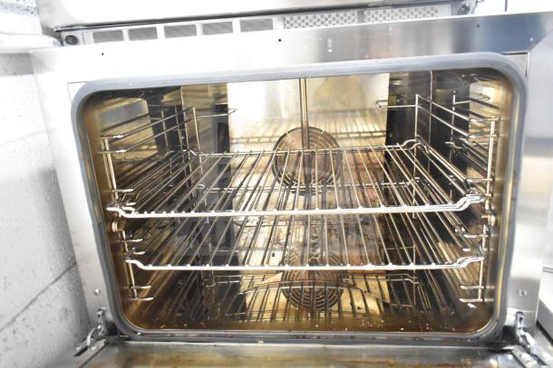 Cadco Unox XAFT133-US Arianna countertop convection oven, stainless steel interior with wire racks, used condition.