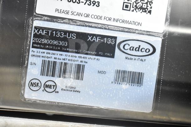 Cadco Unox XAFT133-US Arianna convection oven label showing model, voltage, and weight details. Made in Italy.