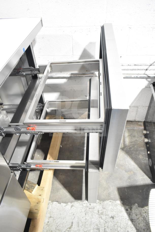 BRAND NEW True TSSU-60-16D-4-HC commercial sandwich salad prep table, stainless steel, 4 drawers, minor scratches.