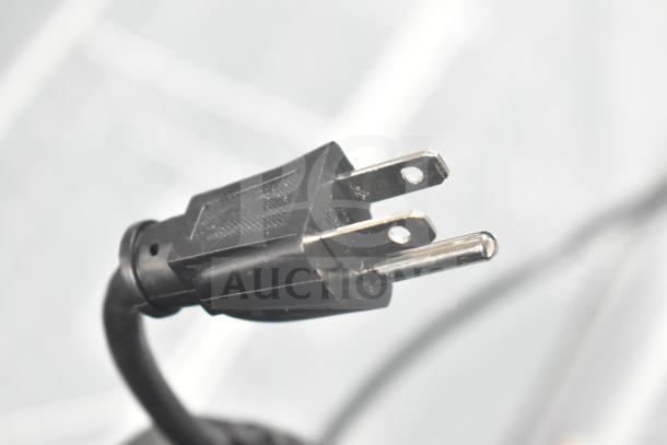 Black power plug of the Hiron SD-300E Commercial Ice Cream Freezer Merchandiser, 115 volts, 1 phase.