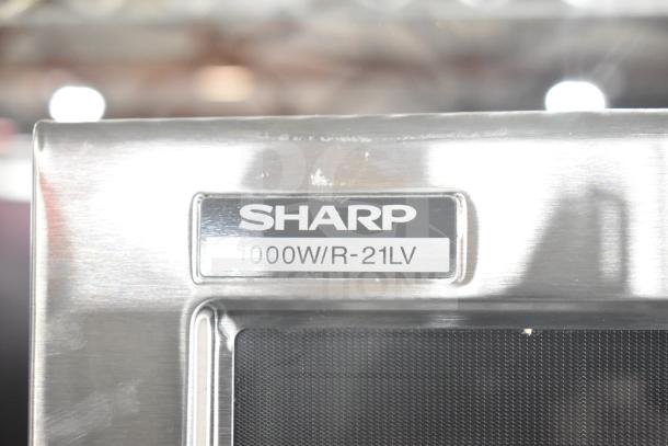 2022 Sharp R-21LVF commercial countertop microwave, 1000W, 120V, excellent condition, model tag visible.