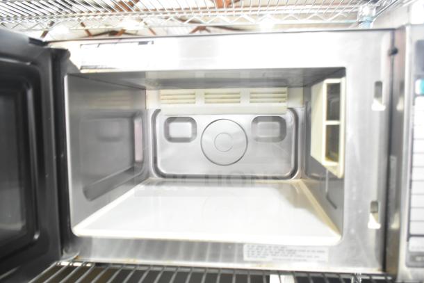 2022 Sharp R-21LVF Commercial Microwave Oven, 120 Volts, open door, clean interior, stainless steel finish.