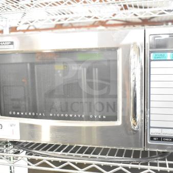 2022 Sharp R-21LVF Commercial Microwave Oven on metal shelf, keypad visible. 120V, 1 Phase, stainless steel exterior.