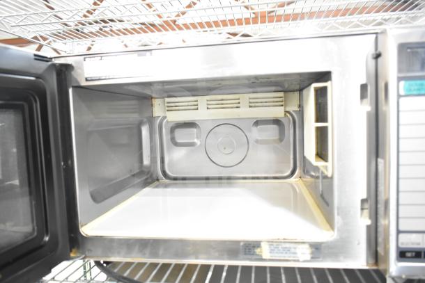 2022 Sharp R-21LVF Commercial Microwave Oven, 120V, open interior view. Silver, clean, with light wear.