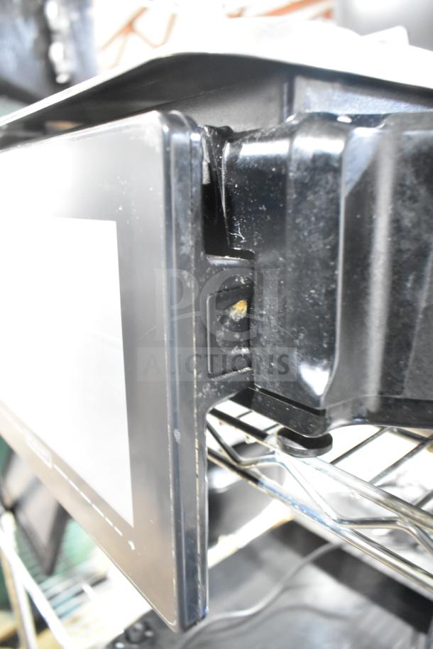2023 Hobart HTi-7LH4W food portioning scale, tested functional, black exterior. Model details visible on side.