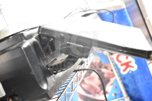 Hobart HTi-7LH4W commercial food portioning scale, tested and working, with visible power cord and durable black casing.