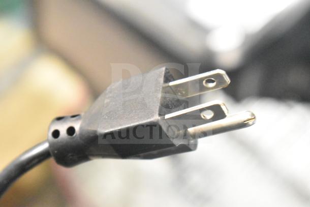 The image shows a close-up of a power plug, potentially from the 2020 Hobart HTi-7LH4W commercial scale.
