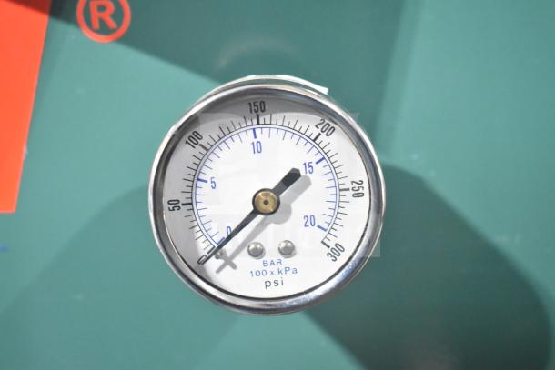 Gauge on Champion 172-1 VR10-12 air compressor, showing pressure in psi and bar, part of commercial floor model.