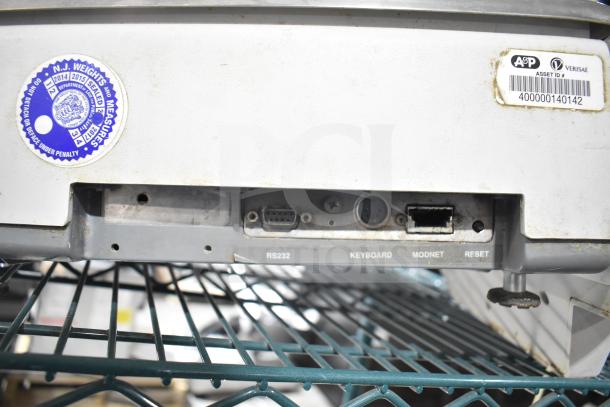 Hobart Quantum commercial scale ports; includes RS232, keyboard, and network connections; NJ Weights sticker visible.