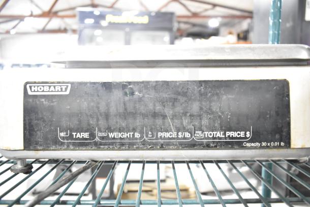 Hobart Quantum commercial scale, tested and working. Features weight, price, and total display. 120 volts, 1 phase.