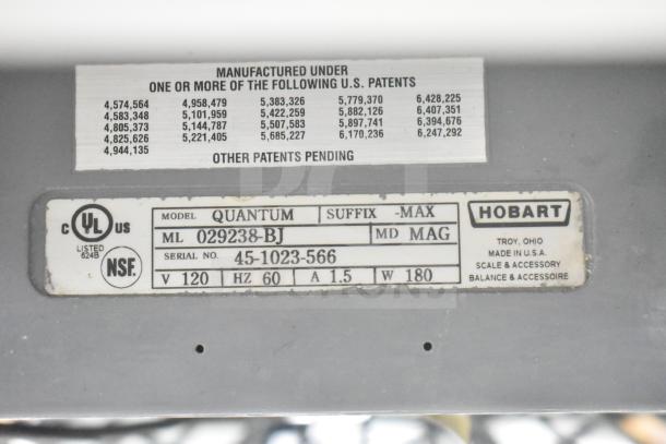 Hobart Quantum commercial food portioning scale label showing model, serial number, and voltage details.
