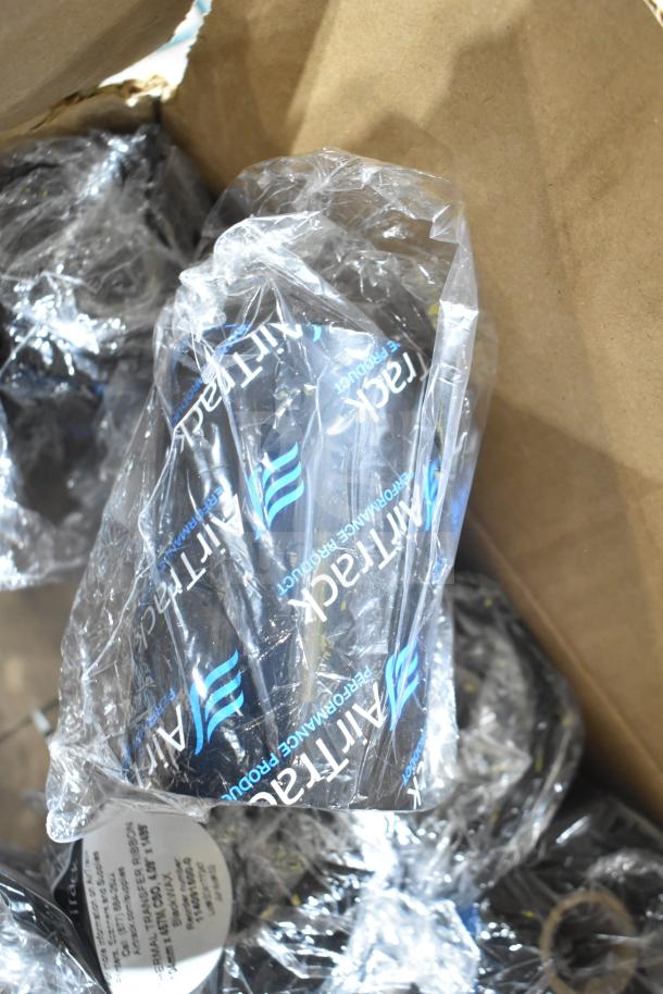 Box with wax ribbons in clear packaging, labeled "AirTrack Performance Product," items appear unopened.