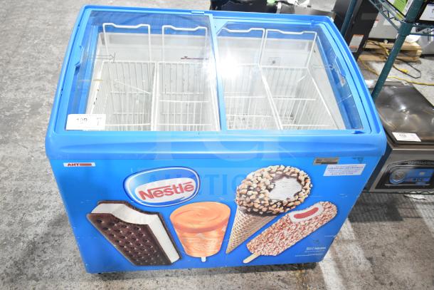 AHT RIO S 100 commercial ice cream freezer, 115 volts, 1 phase, features vibrant Nestlé branding, two lid design.