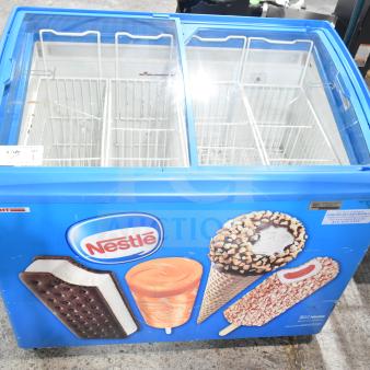 AHT RIO S 100 commercial ice cream freezer, 115 volts, 1 phase, features vibrant Nestlé branding, two lid design.