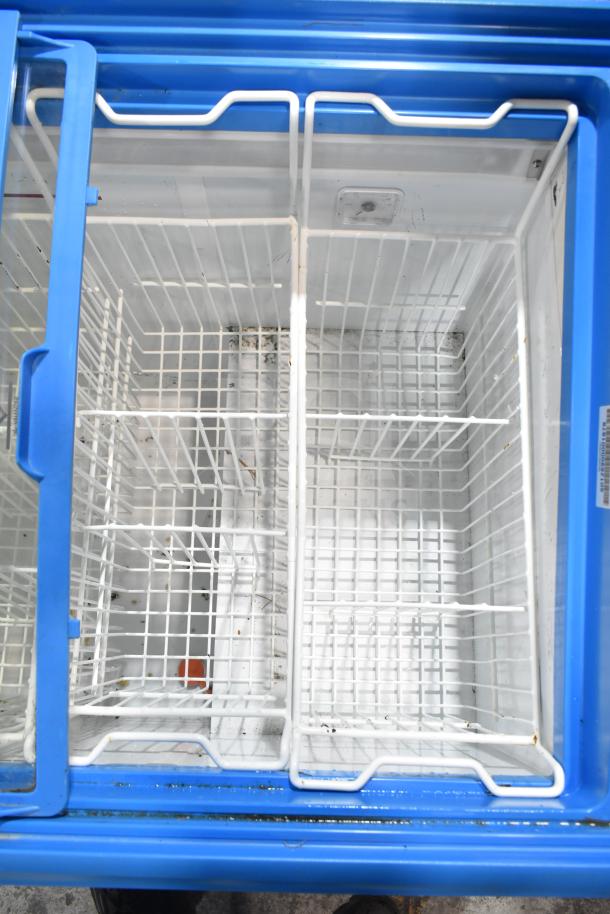 AHT RIO S 100 Commercial Ice Cream Freezer with blue frame, glass lid, grid baskets; 115 volts, 1 phase.