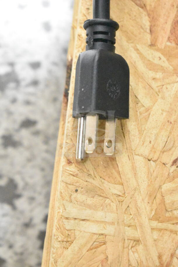 Close-up of a power plug for a 2024 Hoshizaki KM-231BAJ ice machine, showing prongs and insulation.