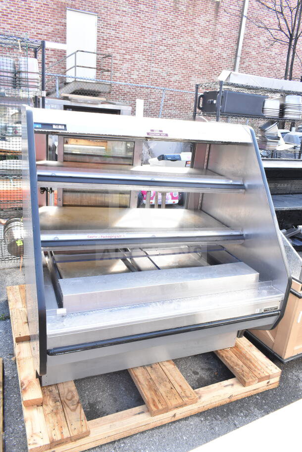 Custom Deli's DILW4SS commercial merchandiser display case, stainless steel, 120/208 volts, 1 phase, on wooden pallet.