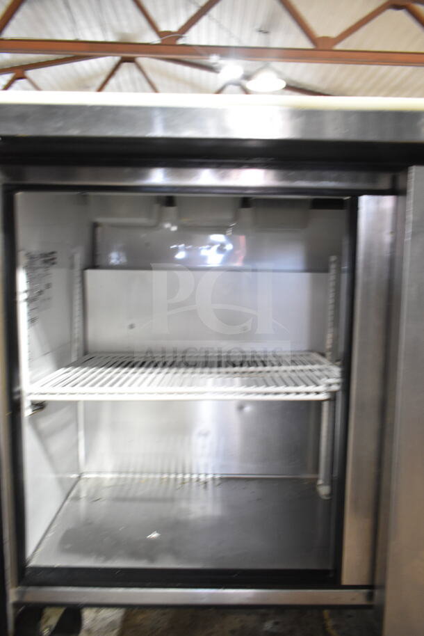 True TSSU-48-08 prep table, stainless steel interior, dual wire shelves, on casters, for commercial use, 115V, 1 phase.