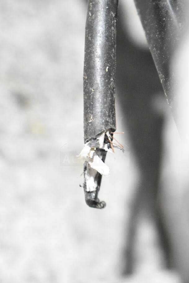 Damaged power cable with exposed wires, showing wear and safety concerns. Suitable for repair or replacement.