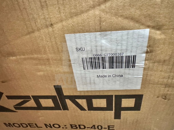 Pristine Zokop BD-40-E compact chest freezer, 1.1 Cu. Ft., unused in original box. Label shows SKU and "Made in China."