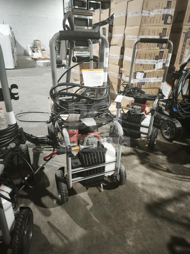 Husqvarna PW2300 Electric Pressure Washer, tested and working, features robust hose, sturdy frame, model label visible.