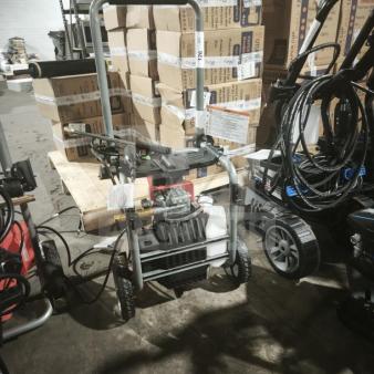 Husqvarna PW2300 electric pressure washer, tested and working, sturdy frame, two wheels, visible pump, handle, and detergent tank.