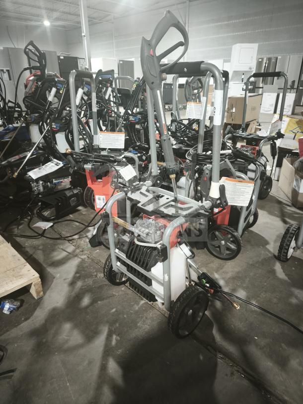 Husqvarna PW2300 Electric Pressure Washer, tested and working. Features sturdy frame, wheels, visible control panel.