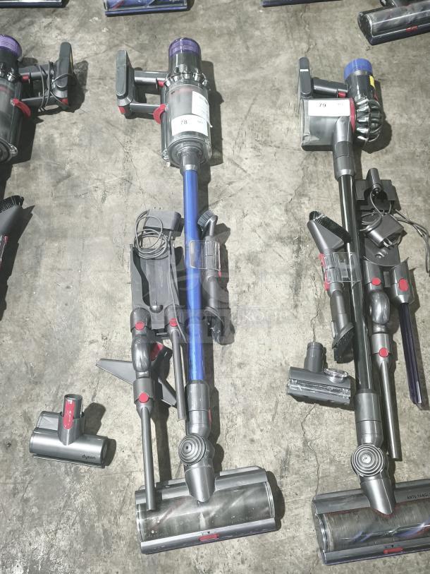 Dyson V11 Torque Drive PLUS cordless stick vacuum, tested and working, includes attachments; visible model label.