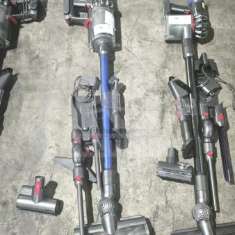 Dyson V11 Torque Drive PLUS cordless stick vacuum, tested and working, includes attachments; visible model label.