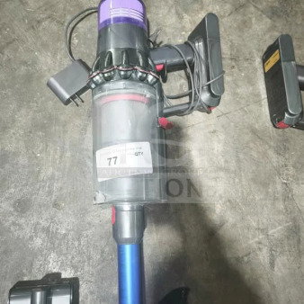 Dyson V11 Torque Drive PLUS cordless stick vacuum, tested and working, features a blue and black design, with visible label.