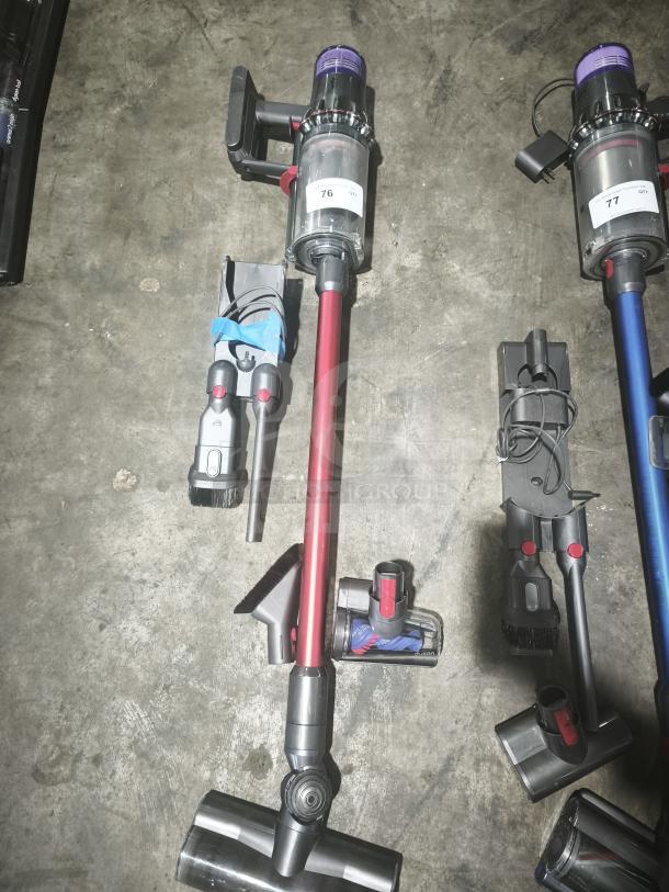 Dyson V11 Torque Drive PLUS cordless stick vacuum, red and black, tested and working, includes attachments, label "76".
