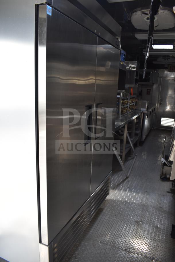 2021 Texino 28ft food trailer interior, featuring CaptiveAire hood, True refrigeration, and Ultrafryer 4-bay fryer.