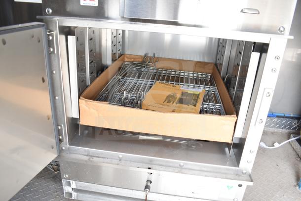 Open Winston CVap holding cabinet in new Texino 28ft food trailer. Includes metal racks and owner’s manual in the box.