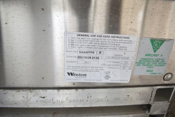 Close-up of a Winston CVap label with model and serial number details, indicating specs and warranty info for a 2021 Texino food trailer appliance.